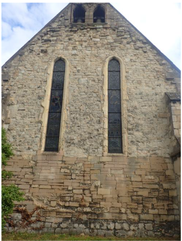Fig. 7. Nave west. Clunch rubble over refacing of Ketton with some Clunch, over plinth of Barnack rubble. 13th-century lancet windows are Clunch, some replaced by Clunch, with Ketton sills; the Ketton probably replaces Barnack.